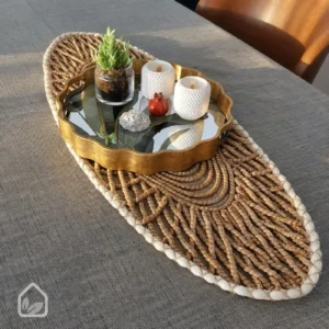 Woven waterproof table runner styled on an oval dining table