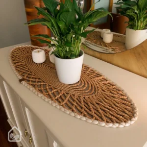 Boho woven table runner styled on a console table